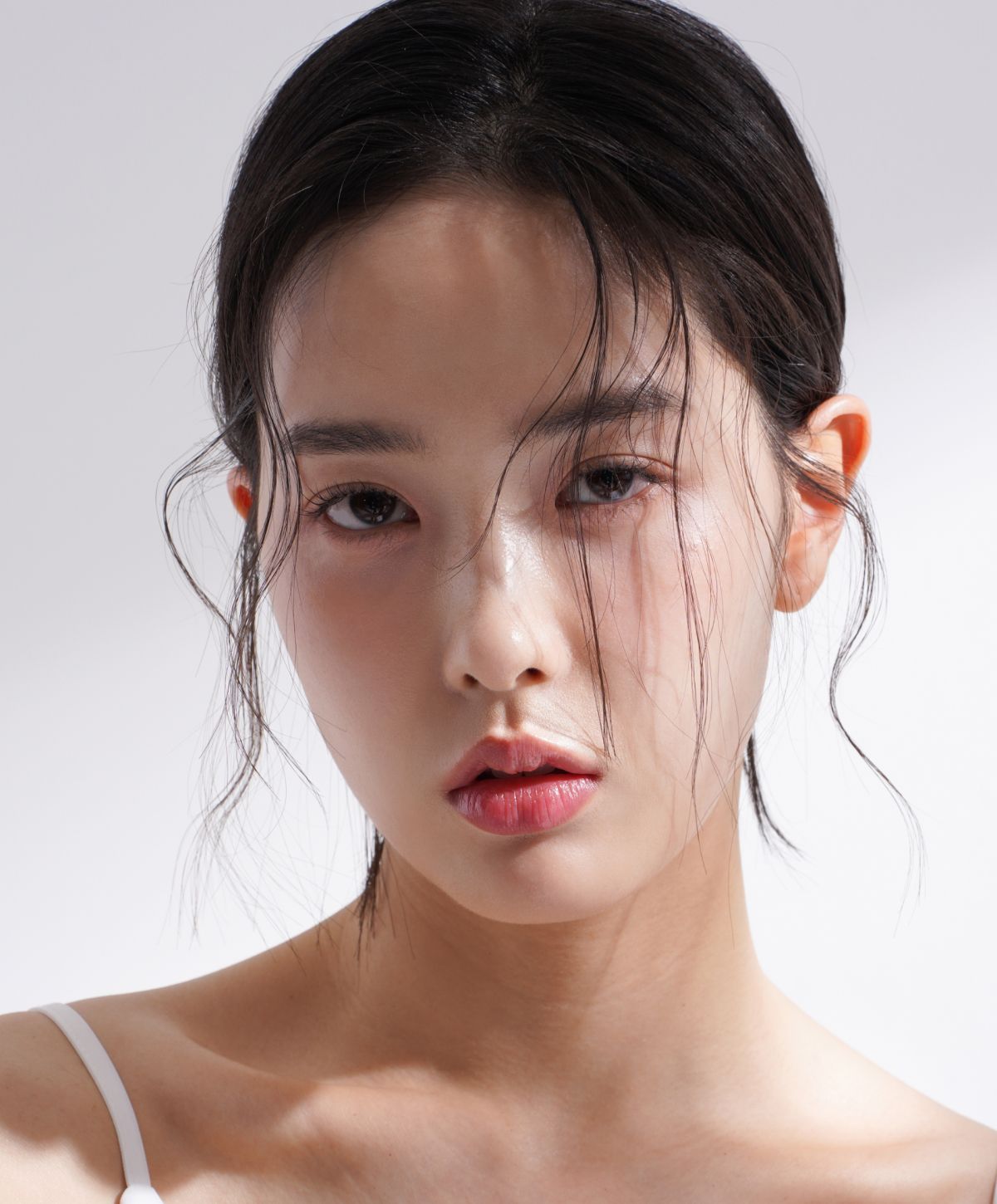 korean beauty services patient model with her bangs in front of her face